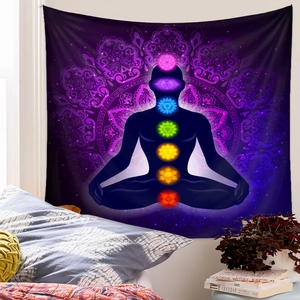 Detailed bedroom wall view of meditation tapestry featuring seven chakra symbols and mandala