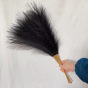 55cm black artificial pampas grass bunch held by hand for boho home decoration