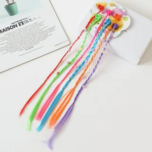 Detailed view of six colorful braided hair extensions for girls with clips and flower decor