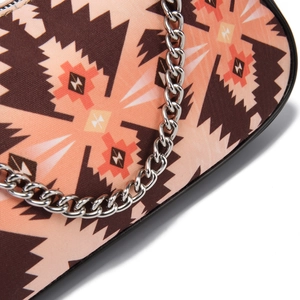 Close-up of Aztec bohemian geometric pattern canvas bag with silver metal chain strap