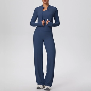 Detail of navy blue three-piece yoga set with zip jacket, vest and straight pants