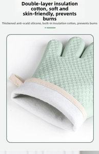 Detail of green silicone heat resistant glove with heart grip pattern and cotton lining