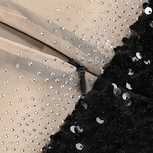 Close-up of black sequins, silver rhinestones, and invisible zipper on mesh dress