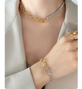 Detail of chunky gold chain jewelry set with rectangle cubic zirconia and OT toggle clasp