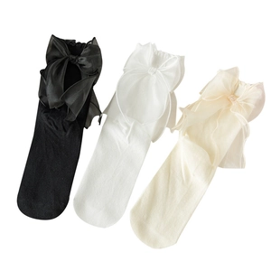 Three pairs of cotton crew socks with large satin bows in black, white, and beige colors