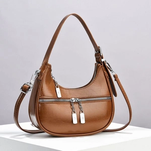 Brown vintage half-moon shoulder bag in glossy soft leather with silver hardware finish