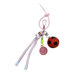 Pink woven rope soccer keychain with mini football pendant and smiley face charm