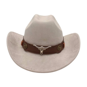 Close-up of cattle head silver metal buckle on brown faux leather band of beige cowboy hat