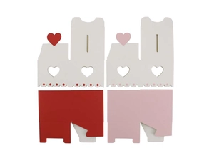 Flat lay of pink and red heart-shaped gift boxes with cutout patterns for weddings