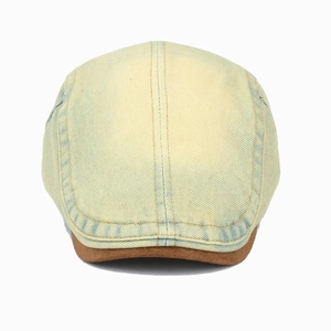Vintage light blue washed denim newsboy cap with brown suede brim on white background