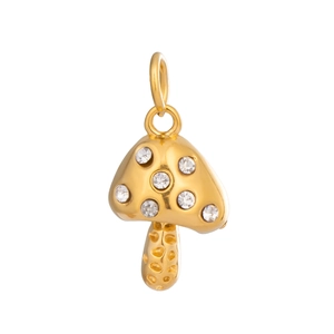 Detailed view of an 18K gold mushroom pendant with sparkling crystal inlay on white