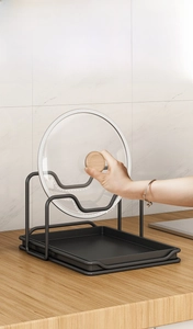 Dual-tier black carbon steel pot lid rack with drip tray for kitchen countertop storage
