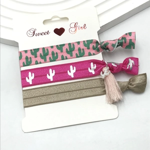 Three-piece elastic hair tie set with cactus print, silver charm and pink tassel