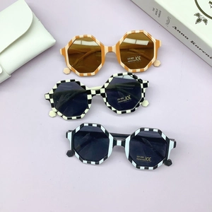 Kids octagonal frame sunglasses with checkerboard patterns and UV400 protection lens