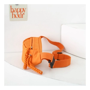 Detail of orange nylon waist bag with woven rope zipper pull and adjustable buckle