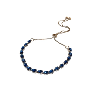 Adjustable silver bolo bracelet featuring pear-cut dark blue cubic zirconia stones