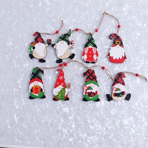 Detail of eight wooden Christmas gnomes with plaid hats and rustic jute hanging ropes