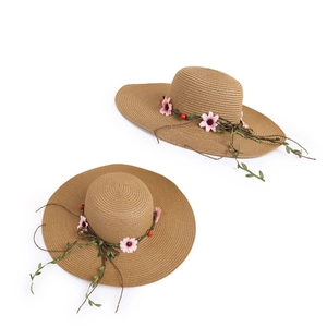 Women's woven straw sun hat with pink daisy floral vine and wide brim for summer uv protection
