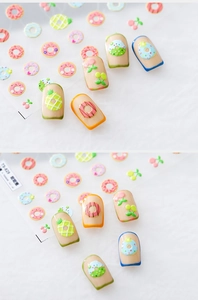 Detailed view of 5D embossed nail art stickers with sweet donut and fruit motifs