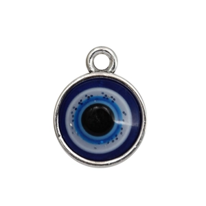Detailed view of round evil eye pendant with blue resin and silver metal for DIY jewelry