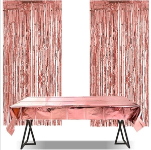 Rose gold foil party set featuring metallic table cover and shimmering fringe curtains
