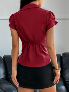 Women's red short sleeve button shirt featuring slim fit ruched back and lapel collar