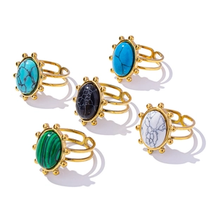 Bohemian gold ring set with five colorful gemstones in turquoise, black, and malachite