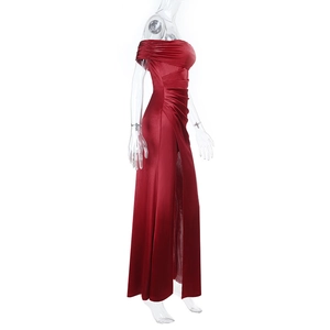 Detail of red off-shoulder satin gown showing side slit and waist pleats on mannequin