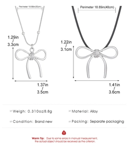 Detail showing dimensions of silver snake chain and black rope knot bow necklaces