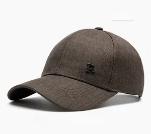 Detailed close-up of coffee brown woolen texture baseball cap with metal R letter
