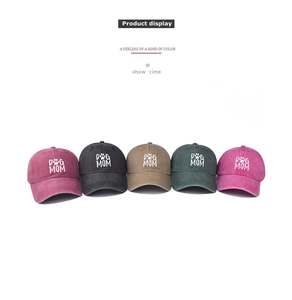 Multi-color collection of washed cotton baseball caps with Dog Mom embroidery details