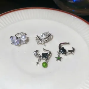 Silver star and pearl ear cuff set with sparkling cubic zirconia and black cat pendants