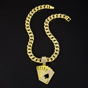 Close-up of gold iced out cuban chain with rhinestone poker cards royal flush pendant