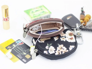 Flat lay of semicircular floral fabric coin purses showing storage for cards and keys
