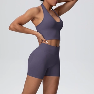 Detail of mauve ribbed seamless yoga set showing racerback sports bra and high-waist shorts
