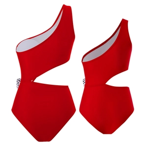 Detail of red one-shoulder cutout swimsuit with polka dot trim side panels