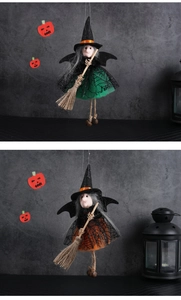 Close-up of hanging witch dolls with colorful spiderweb skirts and small bells