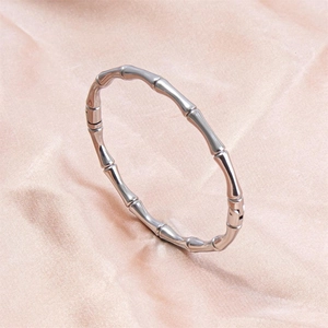 Polished stainless steel adjustable open bangle with a unique bamboo node design