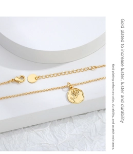 Detail of rose relief pendant with gold plating and adjustable lobster clasp chain
