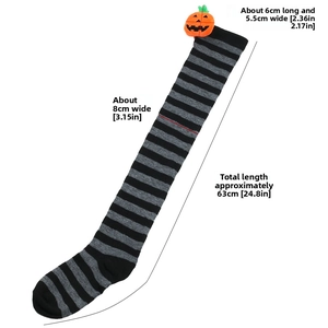 Detailed view of Halloween over-knee socks with black stripes and pumpkin plush decor