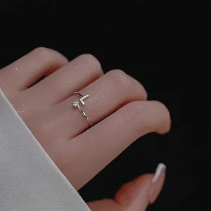 Adjustable silver star and V-shape open ring with sparkling cubic zirconia stones