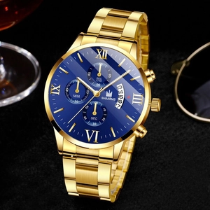Macro view of blue sunray dial with Roman numerals and golden hands of a business watch