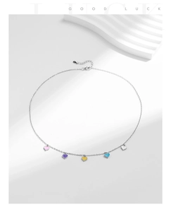 Detail of 925 sterling silver necklace with five colorful enamel heart pendants