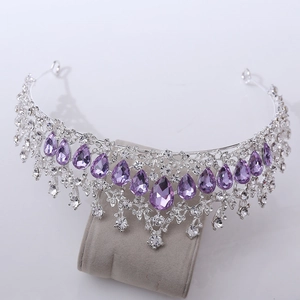 Detail of luxury bridal tiara with sparkling purple crystals and silver rhinestones