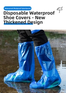 Blue disposable waterproof high-top shoe covers with anti-slip texture on wet ground