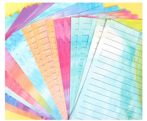 Detail view of watercolor stationery paper sheets with lines in vibrant gradient colors