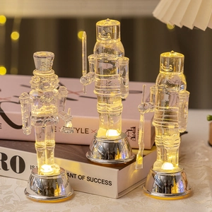 Set of 3 transparent nutcracker soldier LED lamps on decorative books for home decor