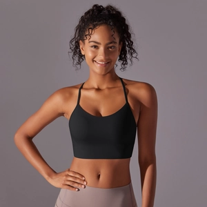 Detail of black racerback sports bra with thin straps and supportive wide underband