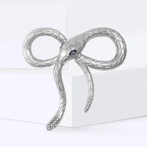 Retro silver alloy snake brooch shaped as a bow with blue gemstone eyes and clear stones