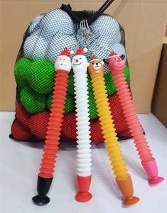 Detail view of four Christmas pop tube toys featuring Santa, Snowman, Bear, and Reindeer